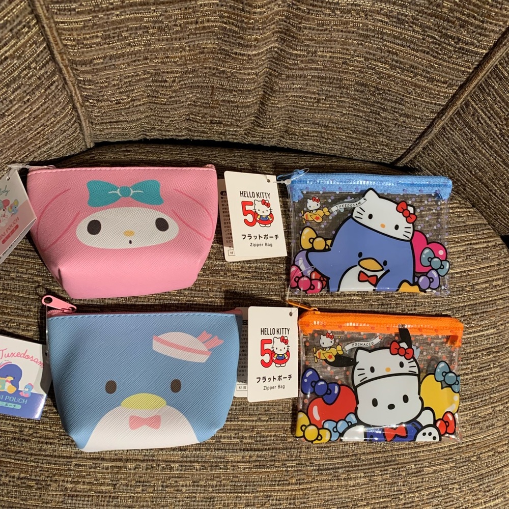 Sanrio mini pouch 11x8 cm new with tag hello kitty/ my melody/tuxedosam/pochacco